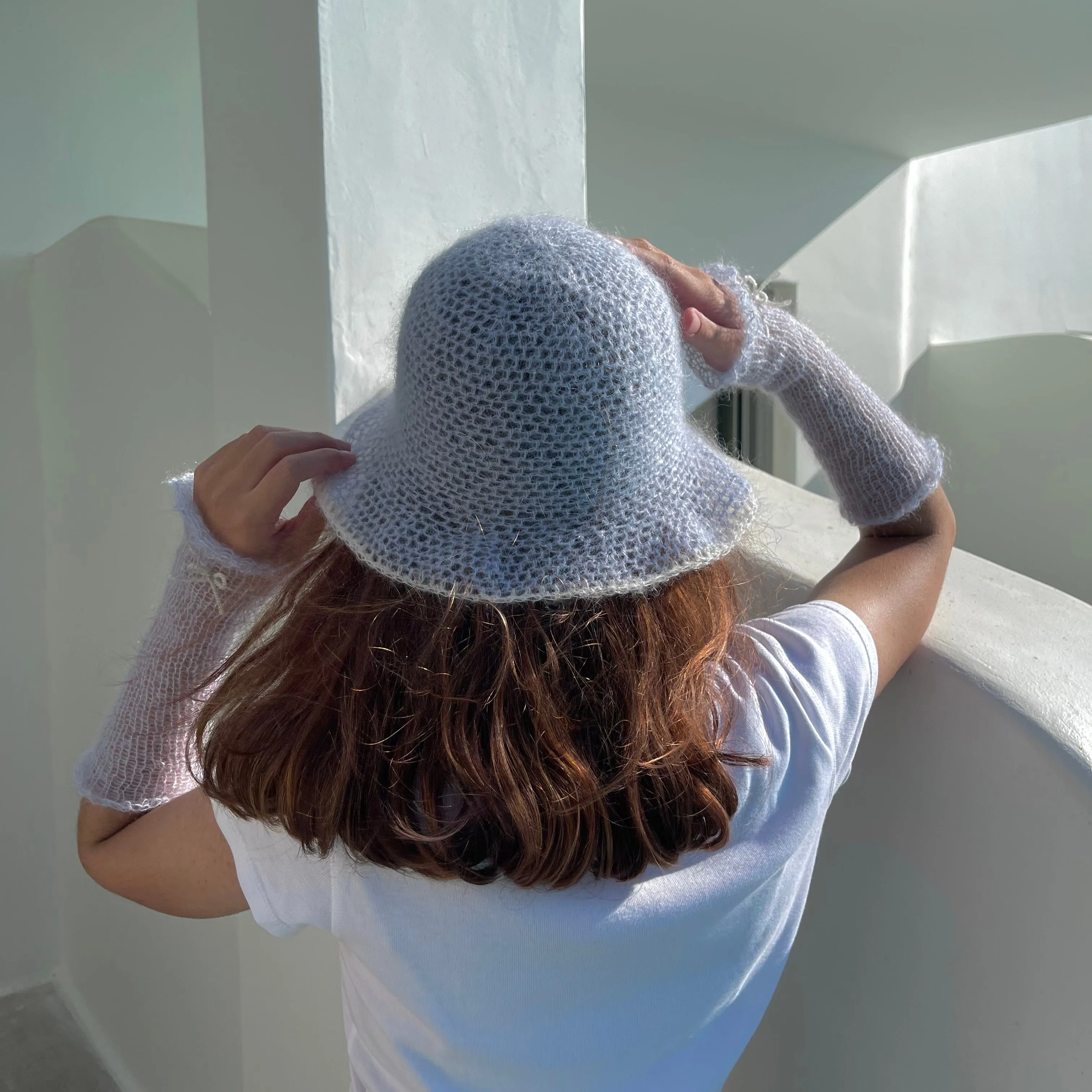 Handmade crochet mohair bucket hat in baby blue with cream trim
