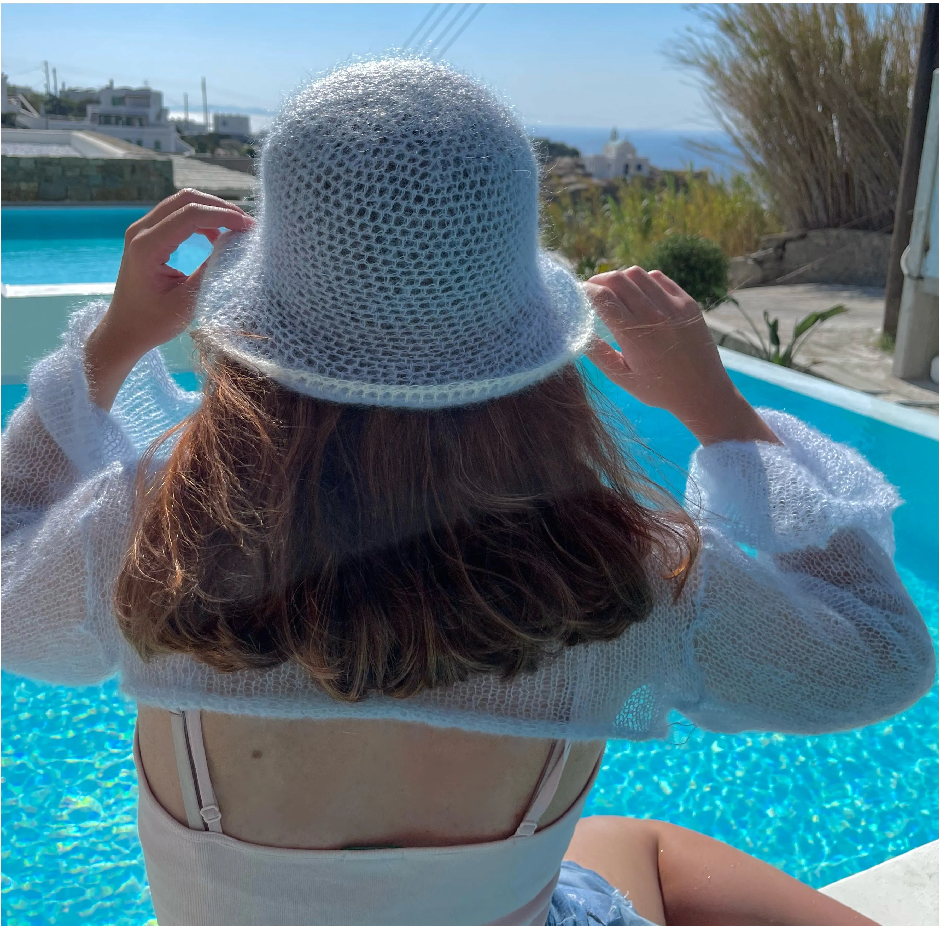 Handmade crochet mohair bucket hat in baby blue with cream trim