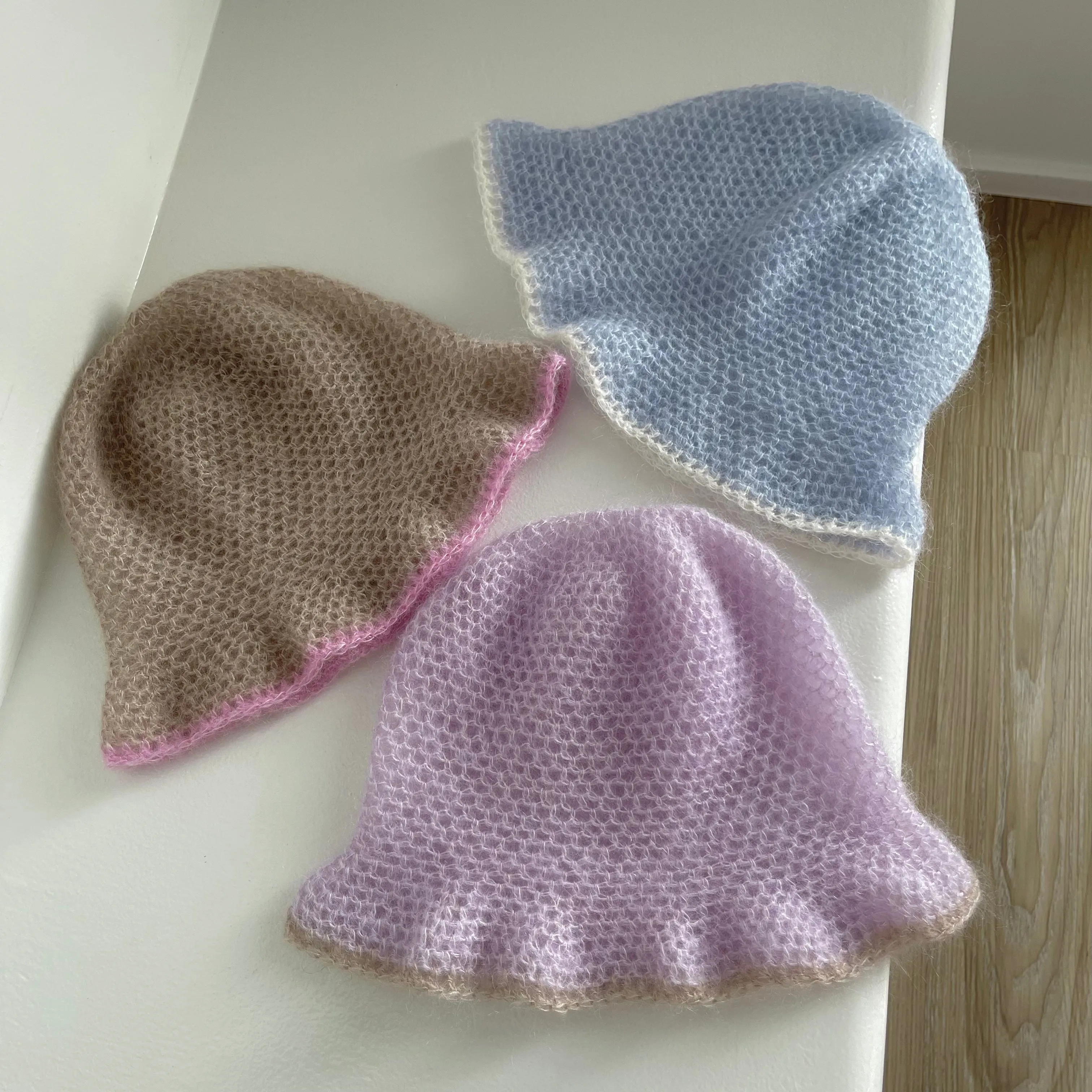 Handmade crochet mohair bucket hat in baby blue with cream trim